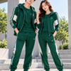 Couple in Coordinated Green Tracksuits (1) Tracksuits & Joggers